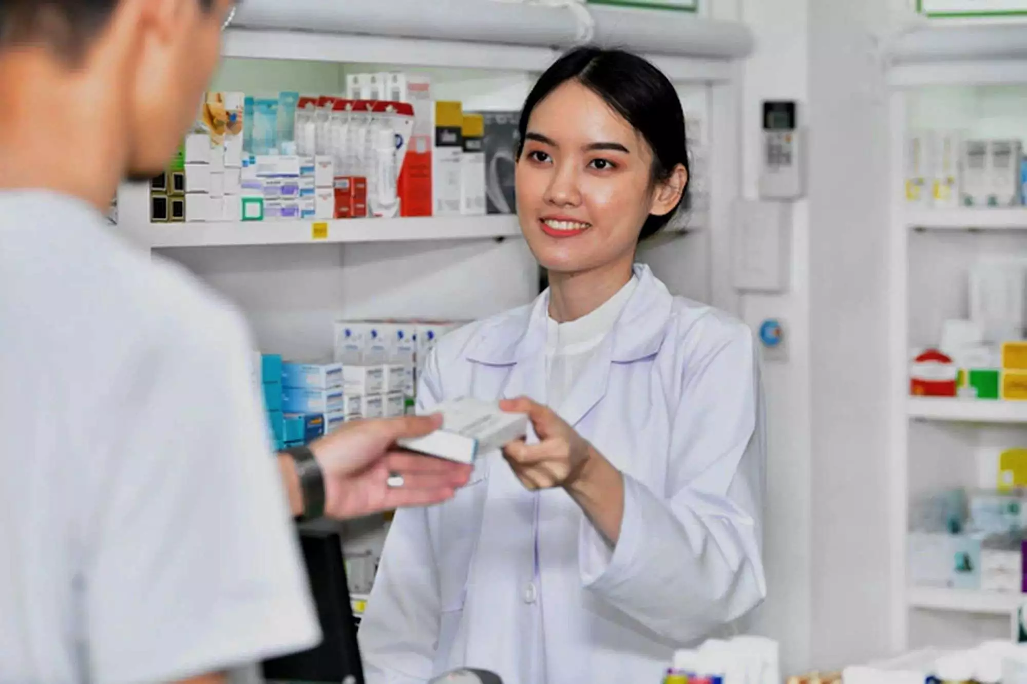 Pharmacist with customer